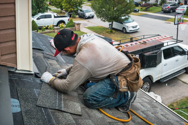 Professional Roofing technician working in Russell, MA